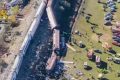 Overturned carriages and makeshift medical tents at Spain train crash site