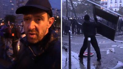 Fireworks and tear gas as protesters and riot police clash in Paris