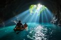 First of five men found alive in flooded Laos cave rescued