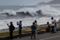East Asia braces for destructive typhoon as landslides kill 15 in Philippines
