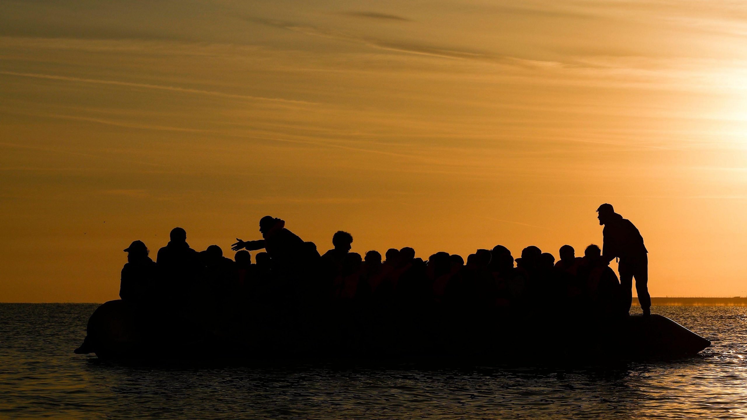 Record 128 people cross Channel in one small boat